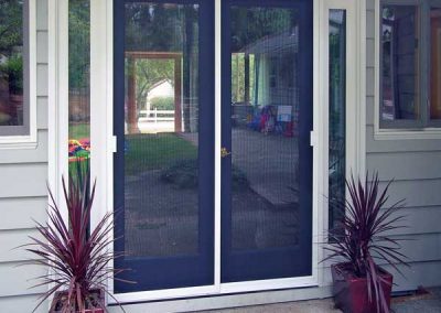 This French door in Beaverton has two by passing sliding patio screen doors on new tracks.
