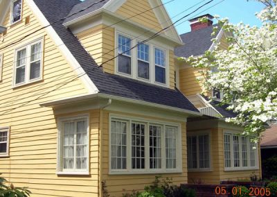 Here in the upstairs windows of this NE Portland home is the Single Hung Storm window (with a screen in the bottom half only) in the Almond color with 1/8" glass for greater weather protection and sound blockage properties